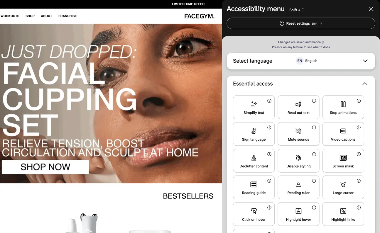 Person using a facial cleansing device on the FaceGym homepage, with the EnableAll accessibility assist bar active.
