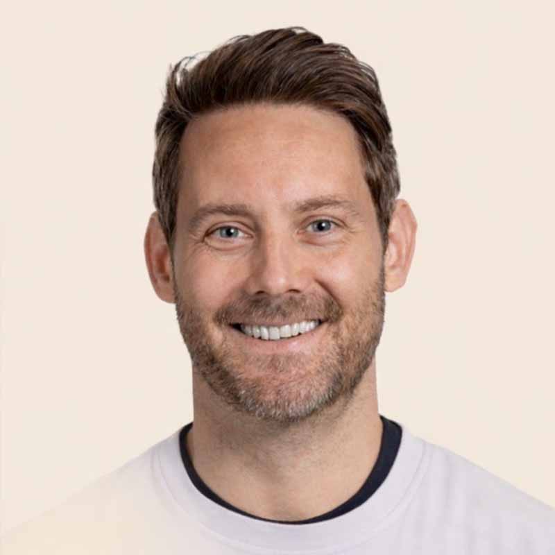 portrait of display champ founder, Joel Garthwaite, wearing a white jumper over a black teeshirt