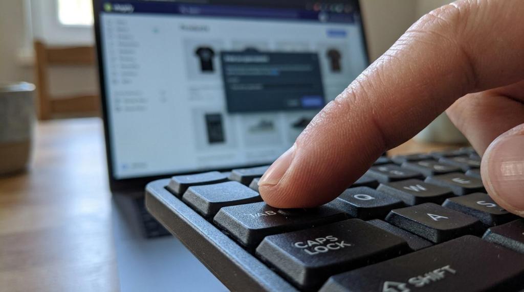 A finger presses a key on a laptop